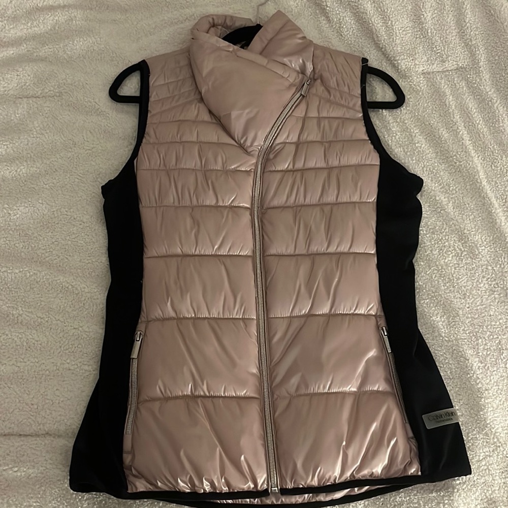 Pink Calvin Klein vest perfect for chilly weather.